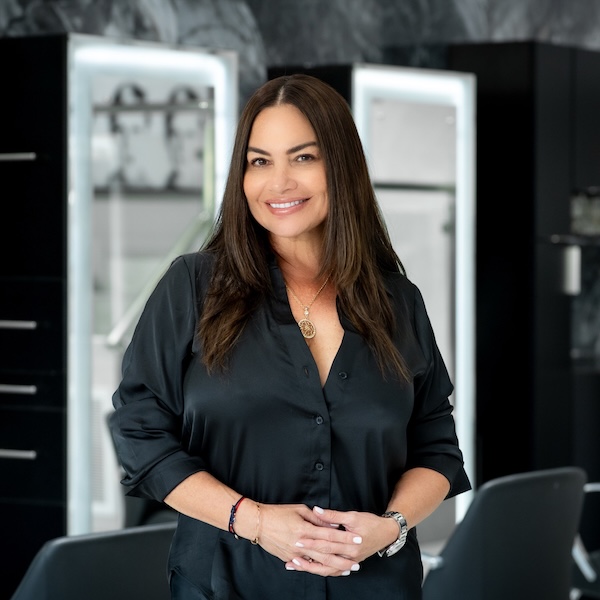 Eugenia our nail tech posing to the camera has long hair