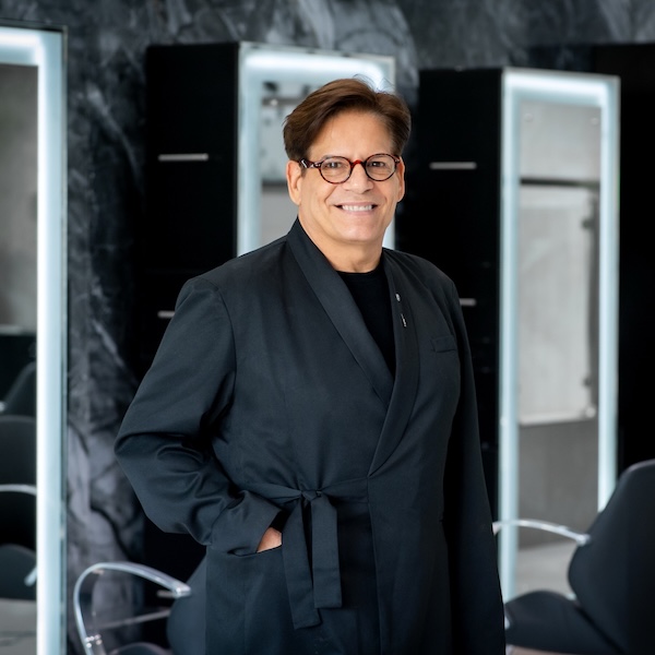 Robert our hairs stylist smiling to tghe camera