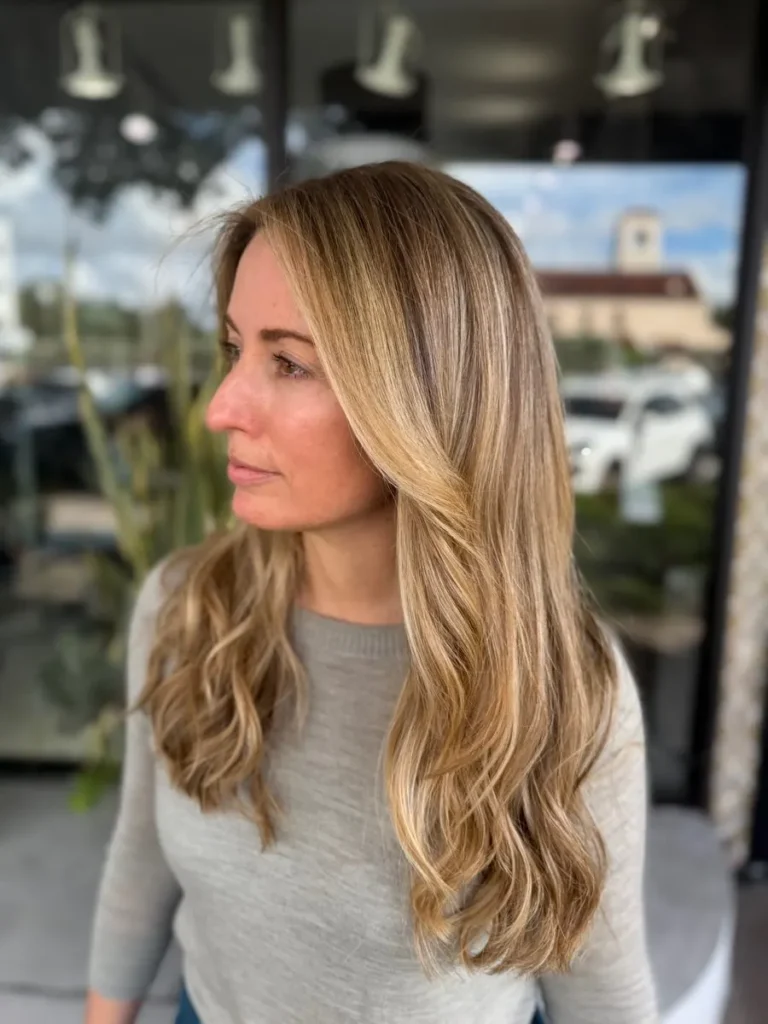 Long honey blonde balayage at MG Hair Studios Coral Gables