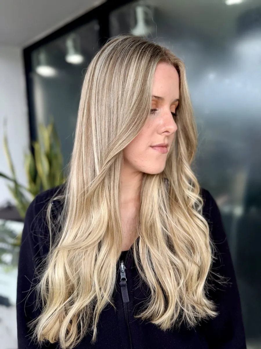 Long blonde balayage waves at MG Hair Studios