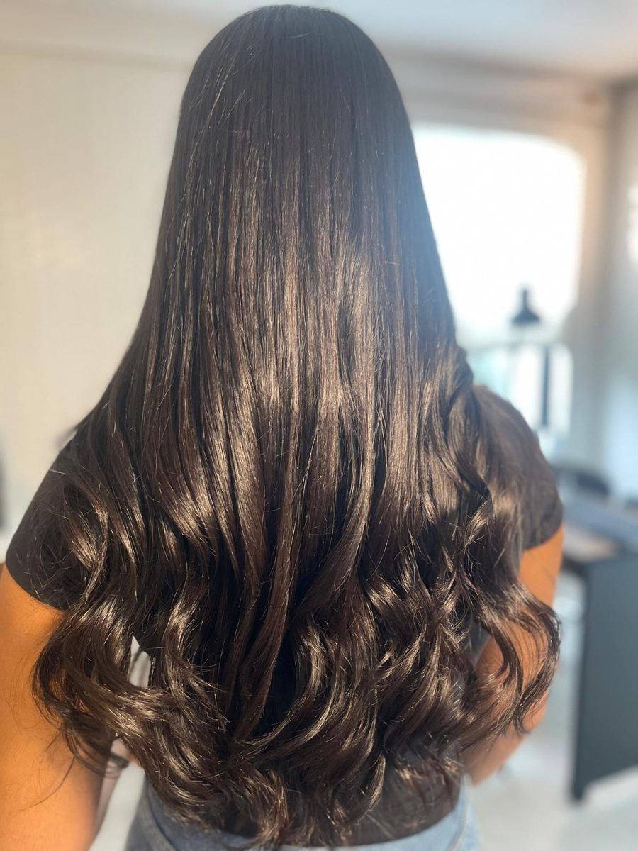 Long smooth shiny dark brown hair, back view, at MG Hair Studios